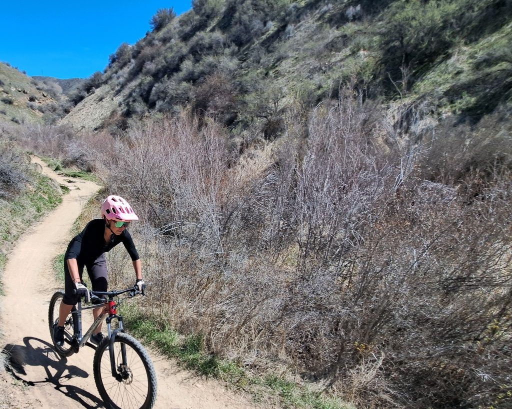 the author riding the polygon xtrada down a mountain bike trail